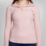 A woman wearing a light pink long-sleeve athletic quarter-zip pullover with a small USRowing logo on the left chest, shown against a neutral light gray background.
